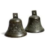 A pair of bronze bells, decorated with reeded bands and a crowned cartouche, the centre with six