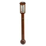 A George III mahogany stick barometer, with an architectural pediment centred with a turned brass