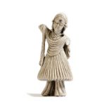 An Indian carved stone figure of a lady, wearing a sari and jewellery, 11.3cm high.