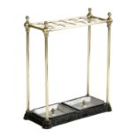 A Victorian brass and cast iron twelve division stickstand, with twin lift-out trays, 62.5cm high,