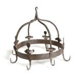 An 18th century wrought iron game crown, with eight hooks and stylised flower and leaf decoration,