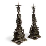 A pair of Italian Venetian bronze torchères after a design by Giuseppe Michieli, each with a pricket