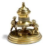 A late Victorian brass nautical inkstand, modelled with two sailors winding rope on a capstan,