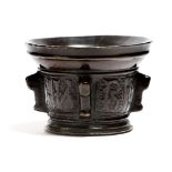 A 16th century Spanish bronze mortar, with four lugs, one perforated with a rope-twist handle,