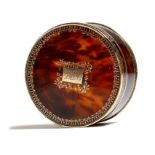 λ A late 18th century French tortoiseshell and gold piqué snuffbox, the lid inset with a rectangular