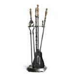 A set of three 19th century fire tools, each with a gilt brass handle decorated with leaves and