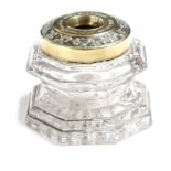 A Victorian octagonal brass and glass anti-blotting inkwell, the rim is decorated with leaves and