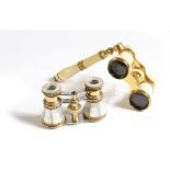 λ A pair of late 19th century French turned ivory and gilt brass mounted opera glasses, with a