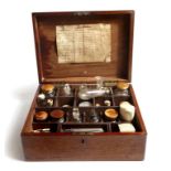 A Victorian mahogany apothecary's box, the hinged top revealing a divided interior, fitted with