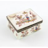 A Saint Cloud porcelain silver-mounted snuff box, c.1748, the cover painted in the Chinese manner