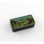 A 19th century lacquered snuff box, unmarked, rectangular form, the hinged cover with a print of a