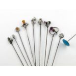 A collection of ten hat pins, comprising: a silver one modelled as a teddy bear, by Charles