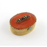 An early 19th century jewel-set, hard stone and gold box unmarked, oval form, the cover set with a