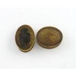 Two 18th century horn snuff boxes, oval form, one with a squirrel to the cover, sitting on a