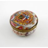 A rare London enamel circular snuff box, c.1740-45, the cover painted with the coat of arms for