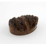 A 19th century Mauchline Ware root and pen work table snuff box, apparently unmarked, the oval cover