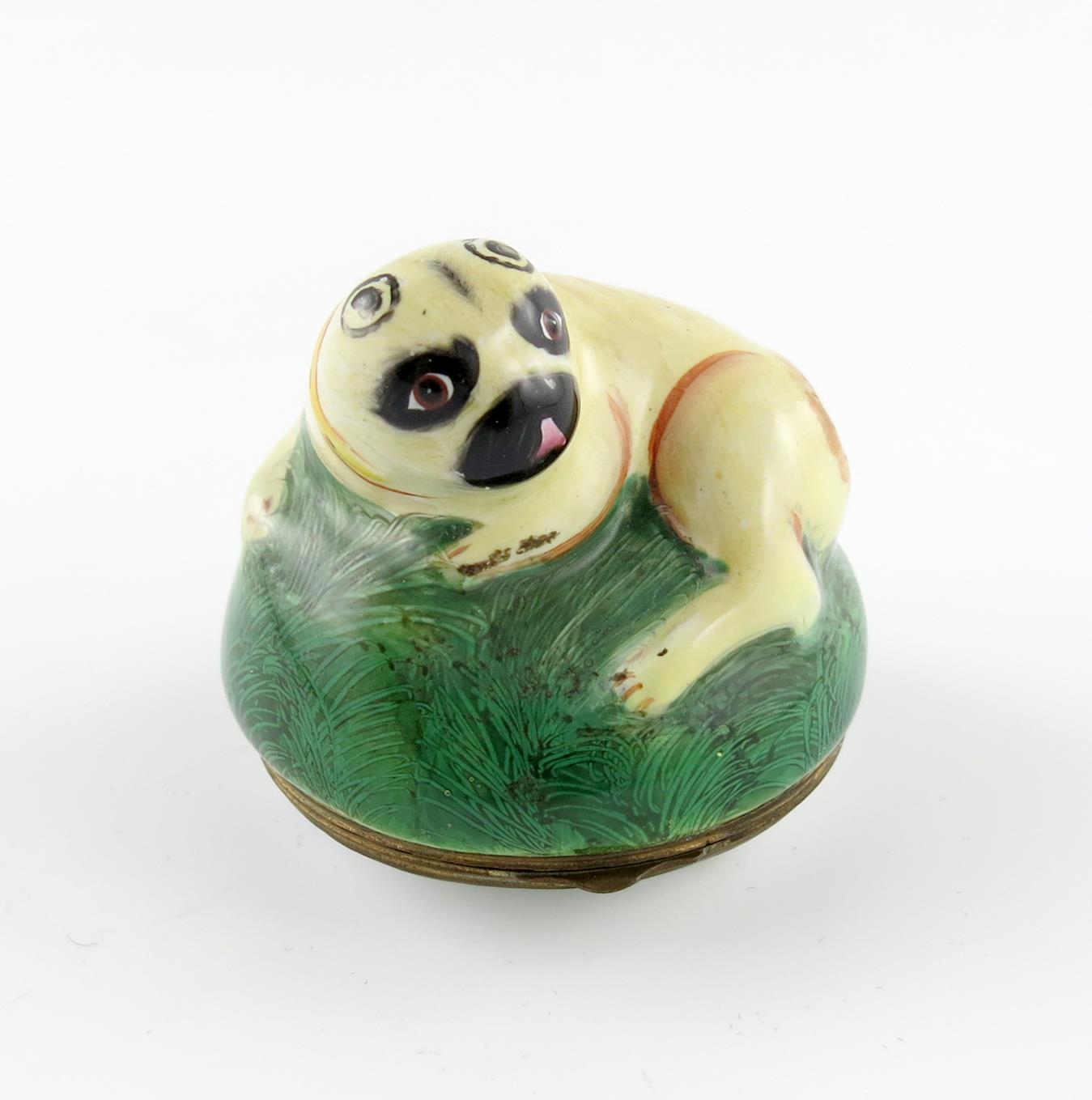 A Birmingham or South Staffordshire enamel bonbonniθre, c.1770, modelled as a pug dog curled up on a
