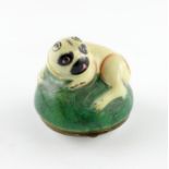 A Birmingham or South Staffordshire enamel bonbonniθre, c.1770, modelled as a pug dog curled up on a