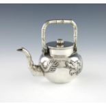 A Chinese silver teapot, by Hung Chong, Canton and Shanghai, circa 1900, circular form, embossed