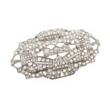A large diamond plaque brooch, the carved and pierced brooch of geometric design, set overall with