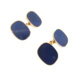 A pair of lapis lazuli mounted gold cufflinks, the cushion-shaped plaques are set with lapis