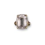 A morganite ring, the large cushion-shaped morganite is set with triangular-shaped rubies to the