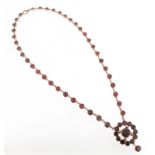 A George III garnet necklace, set with circular-cut garnets and suspending a garnet cluster pendant,