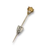 A 19th century gold stickpin, realistically designed as a wild cat with a circular-cut diamond in