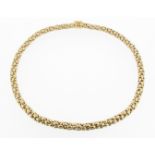 An 18ct yellow and white integrated gold link necklace, 42g, 43.5cm.