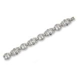 An Art Deco diamond set panel bracelet, the four principal links are each pave-set with an old