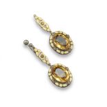 A pair of Arts and Crafts drop earrings in the manner of Bernard Instone, the oval-shaped citrines