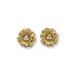 A pair of French stylised gold flowerhead earrings, the textured gold petals set with a trefoil of