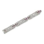 An Art Deco diamond and ruby bracelet, designed as three articulated panels with seven graduated