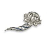 A 1930s diamond and sapphire set foliate brooch, the floral section millegrain-set overall with
