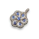 A late Victorian sapphire and diamond pendant, of grounded open-work hexagonal form and set with