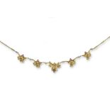 A French gold holly leaf design necklace, mounted with graduated sections of holly leaves with