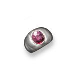 A ruby mounted white gold ring, the cushion shaped ruby is rub over set in a white gold gypsy ring