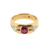 A ruby and diamond three stone ring, the emerald-cut ruby is set either side with an old cushion-