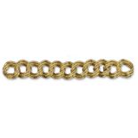 A heavy 18ct yellow gold bracelet, curved and textured links. 20.5cm 209g.