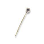 An early twentieth century diamond set stick pin, centred with a cushion-shaped diamond millegrain-