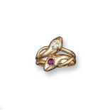 A late Victorian snake ring, the intertwining serpent's heads set with a ruby and a diamond in