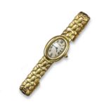 A lady's gold Baignoire wristwatch by Cartier, the plain tonneau-shaped dial with black Roman