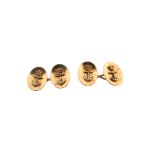 A pair of yellow gold Royal Navy cufflinks, each oval concave disc is applied with a crowned