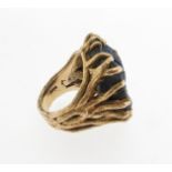 A yellow gold dress ring mounted with a large zoisite matrix, the textured gold mount designed as