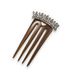A late 19th century diamond-set hair comb, the blonde tortoiseshell comb surmounted with a line of