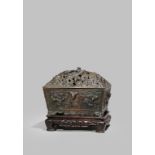 A CHINESE BRONZE RECTANGULAR 'FIVE DRAGON' INCENSE BURNER AND COVER 17TH CENTURY The reticulated