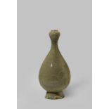 A LARGE CHINESE CELADON GLAZED VASE IN THE SIX DYNASTIES STYLE PROBABLY 20TH CENTURY The pear-shaped