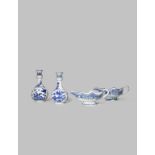 A NEAR PAIR OF CHINESE BLUE AND WHITE VASES AND TWO SAUCE BOATS 18TH CENTURY The vases with pear-