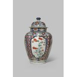 A LARGE JAPANESE IMARI BALUSTER VASE AND COVER C.1700 The octagonal body decorated in underglaze