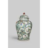A LARGE CHINESE FAMILLE VERTE BALUSTER VASE AND COVER KANGXI 1662-1722 The body decorated with